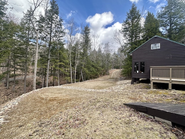 view of yard featuring a wooden deck