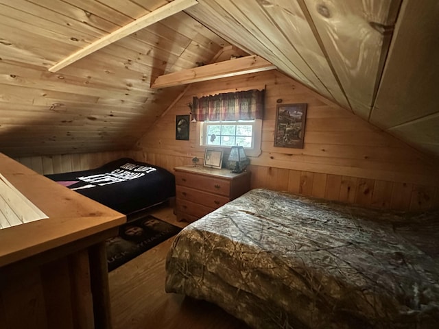 bedroom featuring wood-type flooring, wood ceiling, vaulted ceiling, and wooden walls