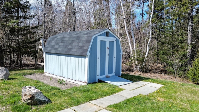 view of shed / structure featuring a lawn