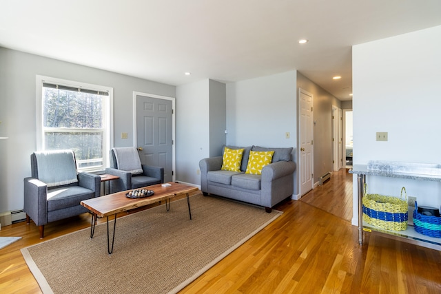 living room featuring light hardwood / wood-style flooring and a baseboard radiator