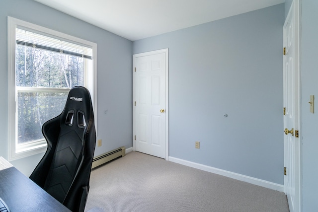 home office with plenty of natural light, light carpet, and baseboard heating