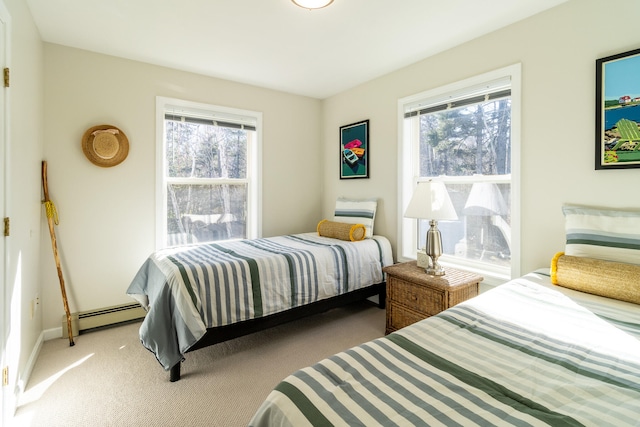 carpeted bedroom with a baseboard radiator