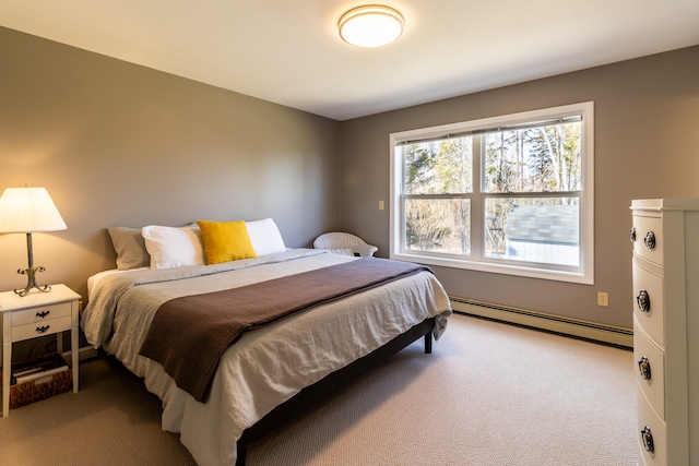 carpeted bedroom featuring a baseboard heating unit