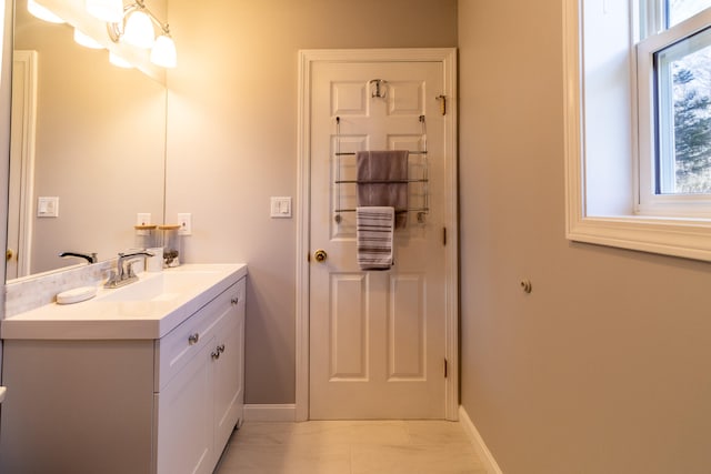 bathroom featuring tile floors and oversized vanity