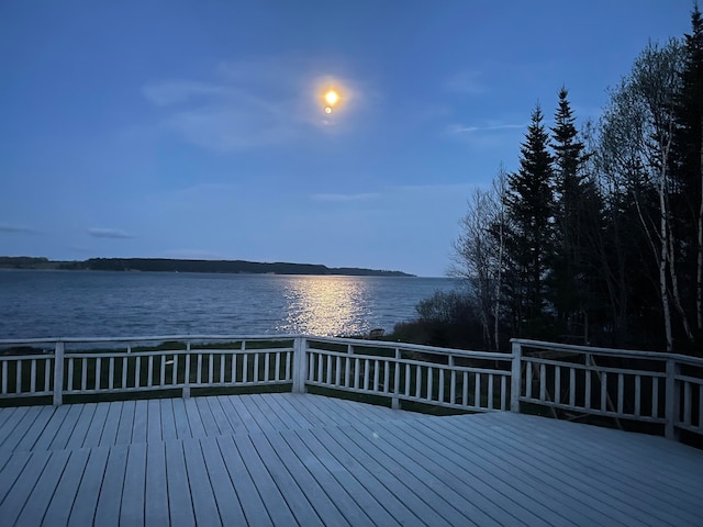 deck at dusk with a water view