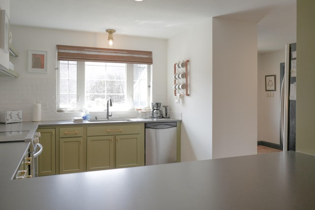 kitchen featuring green cabinets, electric range, sink, tasteful backsplash, and dishwasher