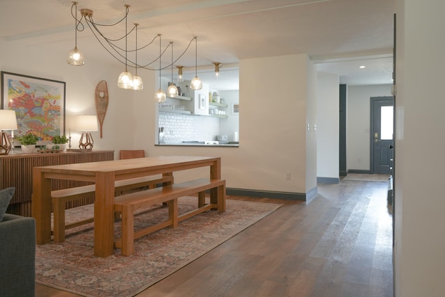 dining space featuring dark hardwood / wood-style floors