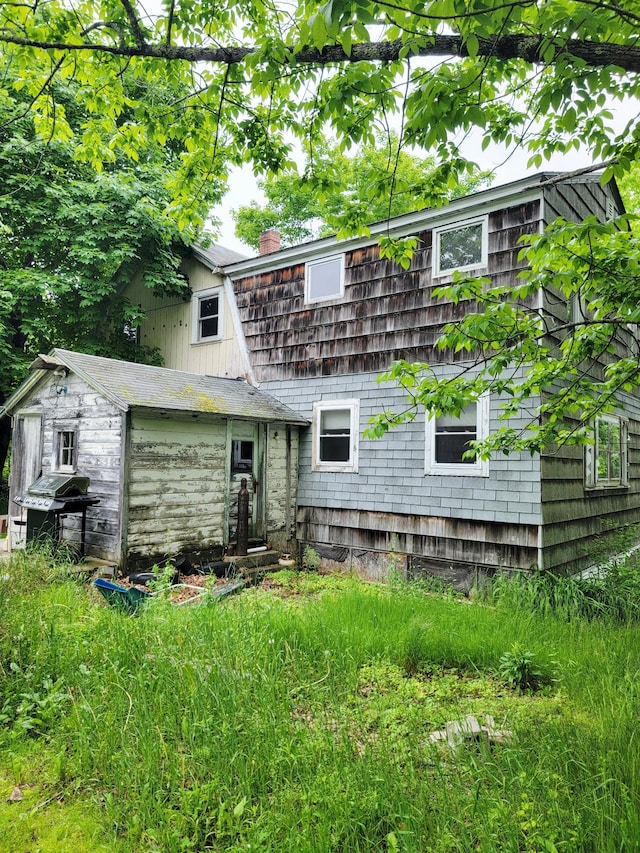 17 Otter Creek Dr, Mount Desert, ME 04660 - back of house featuring a chimney