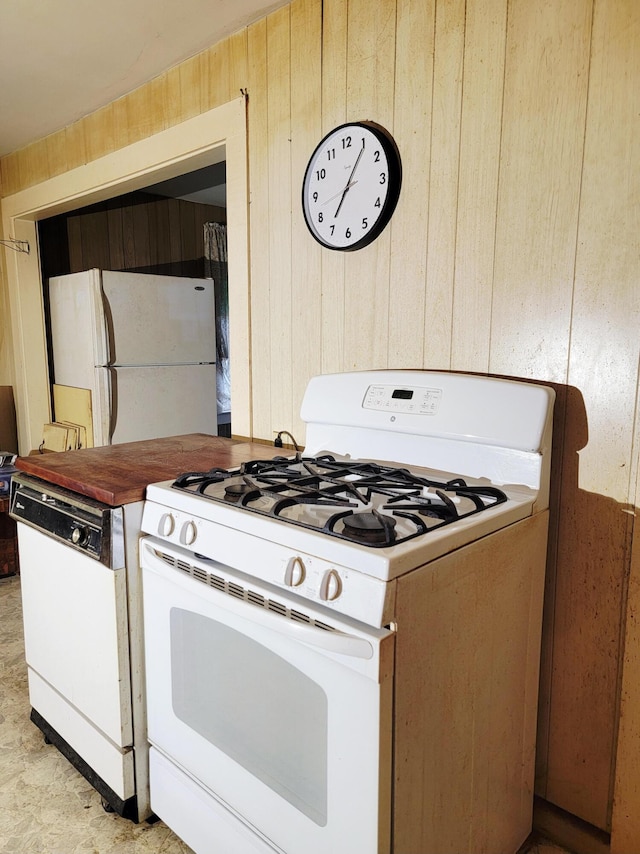 17 Otter Creek Dr, Mount Desert, ME 04660 - kitchen featuring white appliances and wooden walls