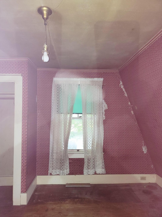 17 Otter Creek Dr, Mount Desert, ME 04660 - empty room featuring wallpapered walls, crown molding, and wood finished floors