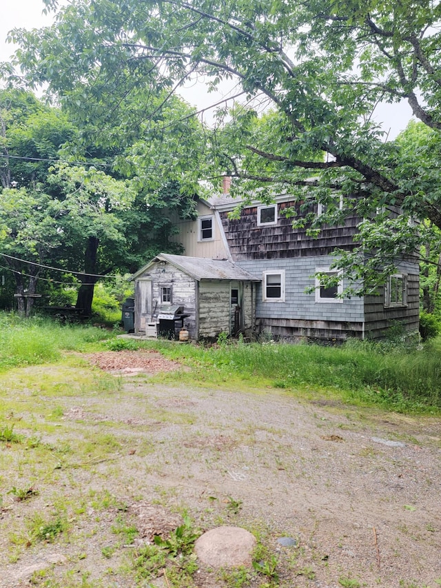 17 Otter Creek Dr, Mount Desert, ME 04660 - rear view of property featuring a chimney