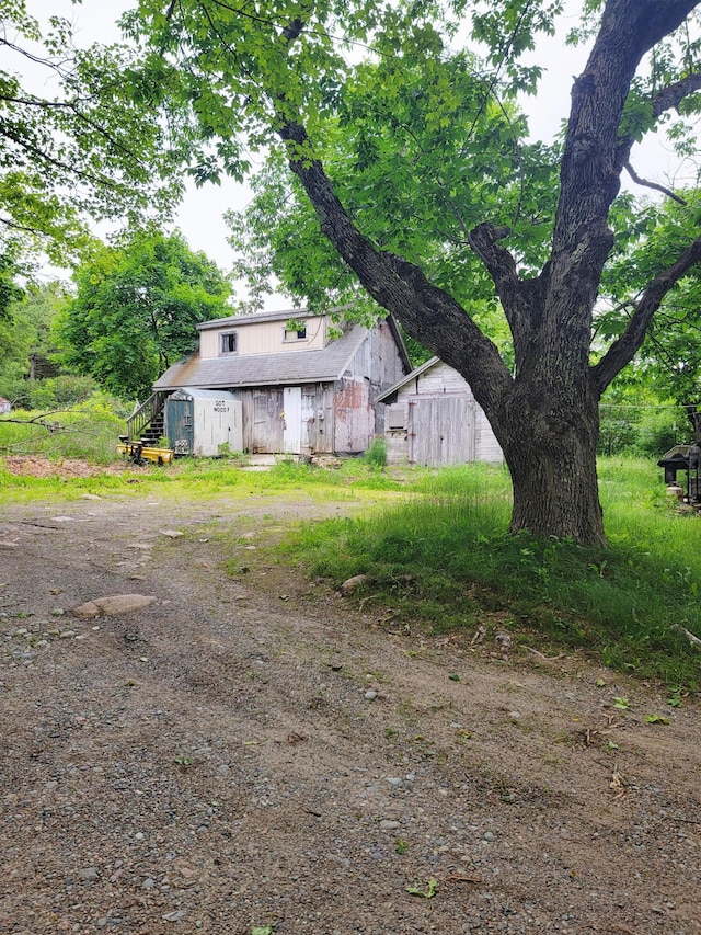 17 Otter Creek Dr, Mount Desert, ME 04660 - view of yard featuring a barn and an outdoor structure