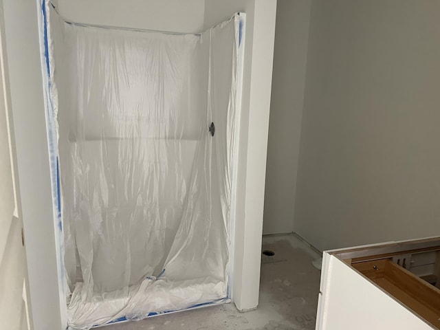 bathroom with a stall shower