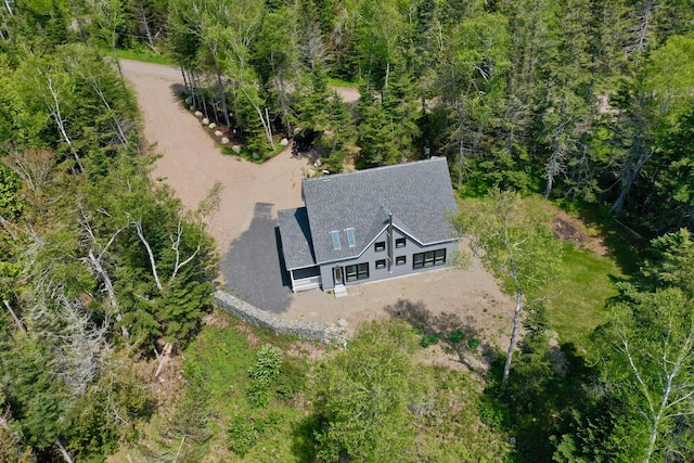 aerial view featuring a wooded view