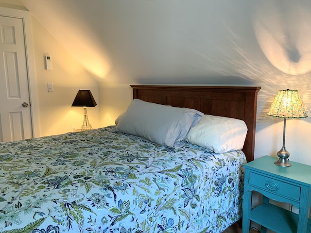 bedroom featuring lofted ceiling