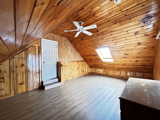 additional living space with wood ceiling and hardwood / wood-style flooring