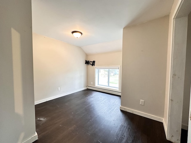 unfurnished room with a baseboard radiator, dark wood-type flooring, and lofted ceiling