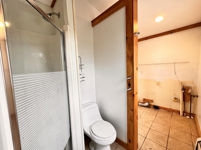 bathroom with toilet and tile flooring