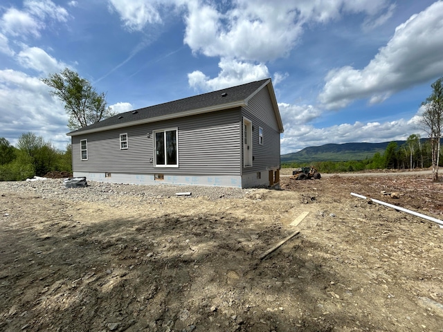 back of house featuring a mountain view