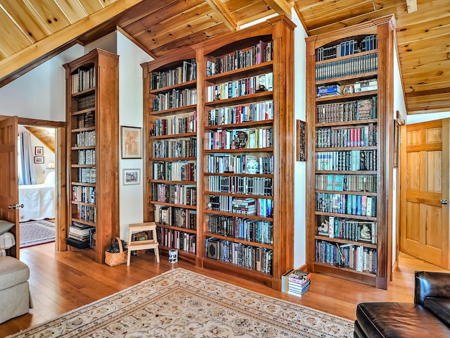 sitting room with lofted ceiling, wood-type flooring, and wooden ceiling