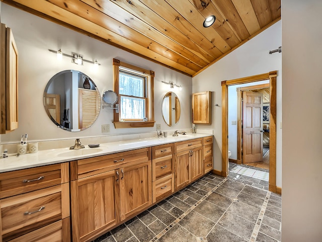 bathroom featuring vanity, toilet, wooden ceiling, and vaulted ceiling