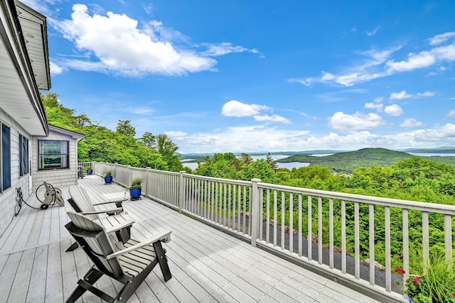 wooden deck featuring a mountain view