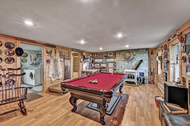 rec room featuring washer and clothes dryer, wood walls, billiards, and light hardwood / wood-style flooring