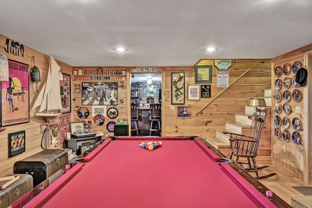 game room with wooden walls and pool table