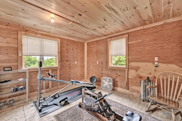 workout area with wood walls, radiator heating unit, and wood ceiling