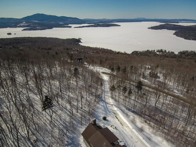 snowy aerial view with a mountain view