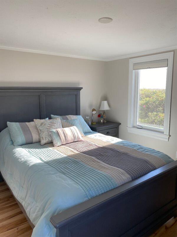 bedroom with hardwood / wood-style flooring