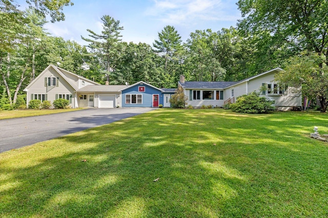 ranch-style house with a front yard and a garage