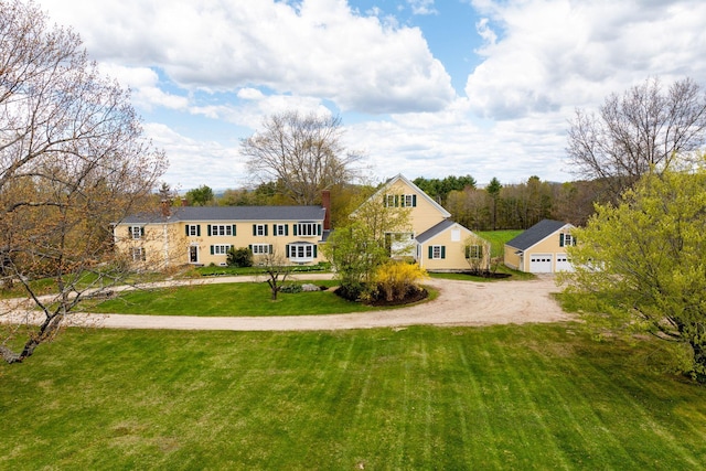 view of front facade with a garage and a front lawn