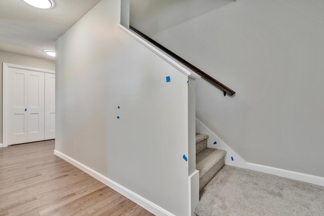 staircase featuring light hardwood / wood-style flooring