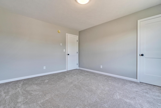 spare room featuring carpet flooring