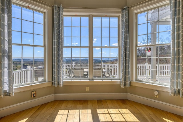 unfurnished sunroom with plenty of natural light