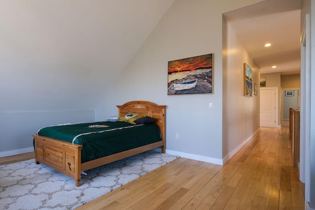 bedroom featuring light wood-style floors, recessed lighting, and baseboards