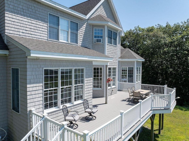 wooden terrace with outdoor dining area