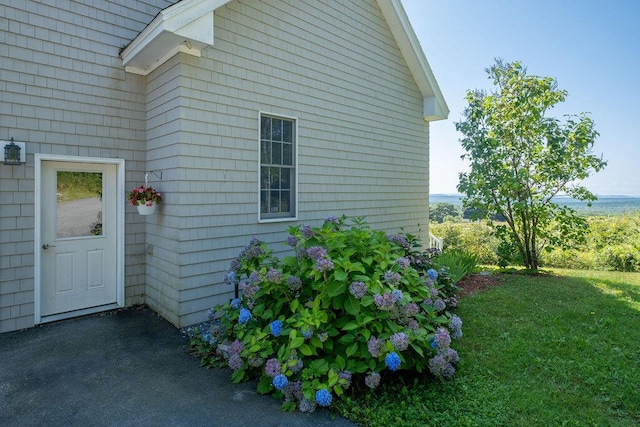 view of side of property with a yard