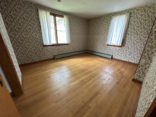 unfurnished room with light wood-type flooring