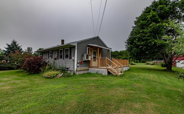 view of front of property with cooling unit and a front yard