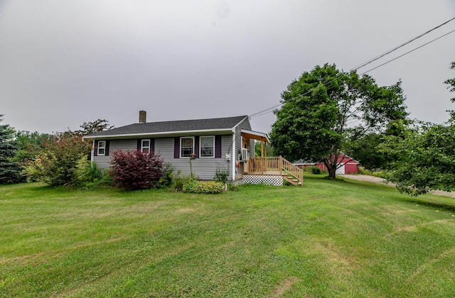 exterior space featuring a front yard and a deck