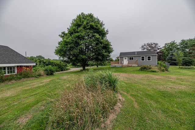 view of yard featuring a wooden deck