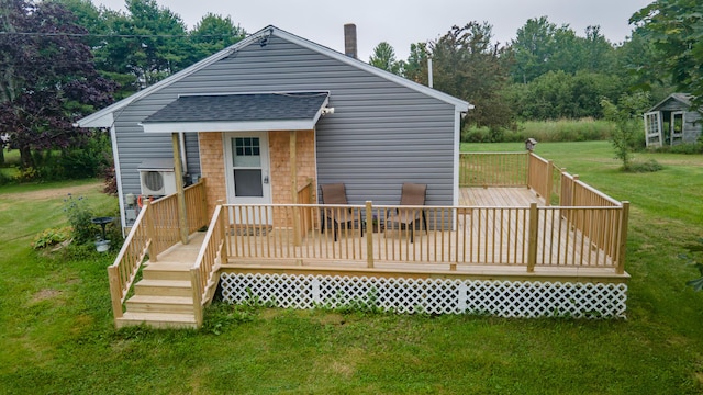 wooden terrace featuring a lawn