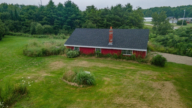 view of property exterior with a yard