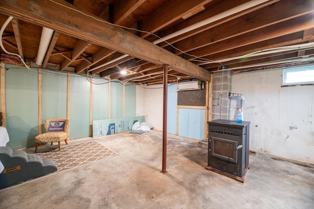 basement featuring a wall mounted air conditioner