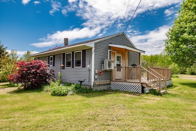 14 Porter St, Searsport, ME 04974 - view of front of home with a chimney, a front lawn, and a cooling unit