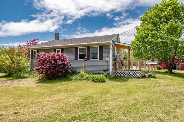14 Porter St, Searsport, ME 04974 - view of side of home featuring a chimney, a lawn, and a shingled roof