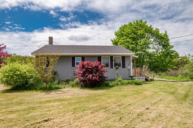 14 Porter St, Searsport, ME 04974 - view of front of home featuring a chimney and a front yard