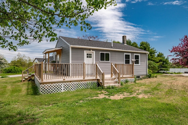 14 Porter St, Searsport, ME 04974 - rear view of property featuring a yard, a wooden deck, and roof with shingles
